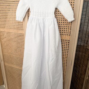 Faldón de punto en algodón con plumeti